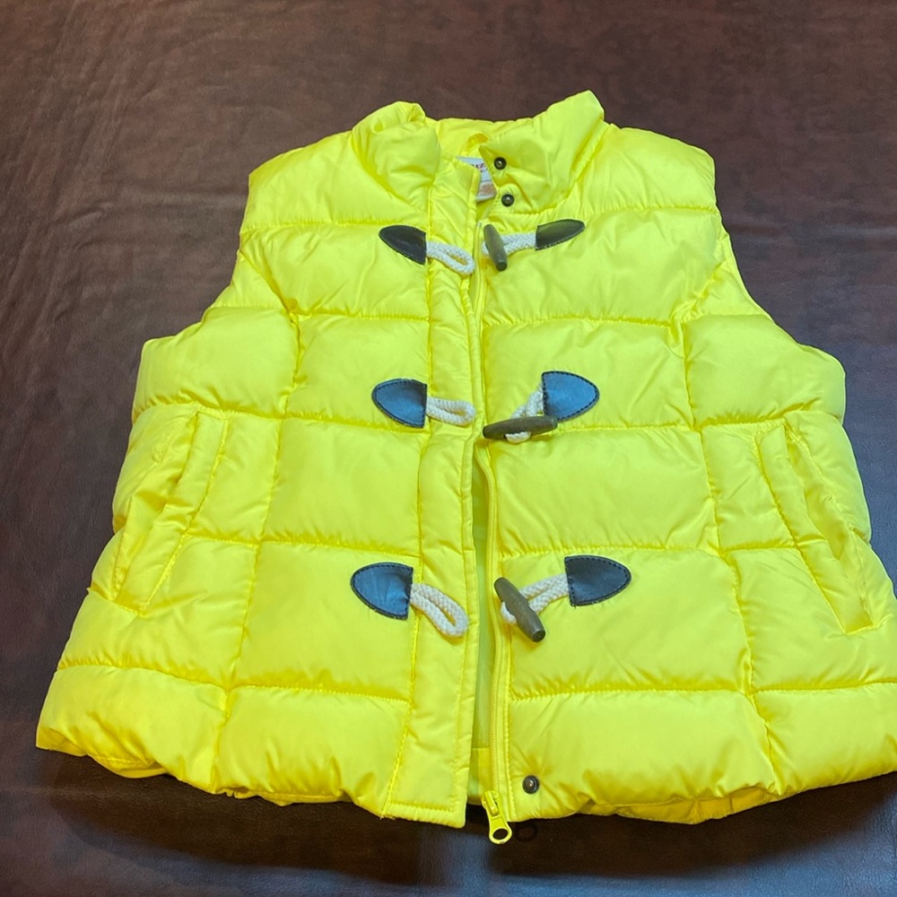 Yellow puffy vest, size large Jr.’s